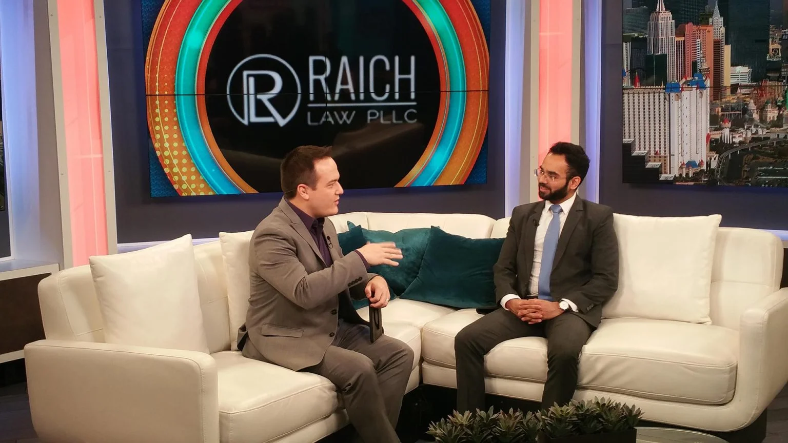 Channel 13 Morning Blend TV studio interview with the Raich Law PLLC logo on screen