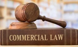 Gavel resting on a book titled Commercial Law