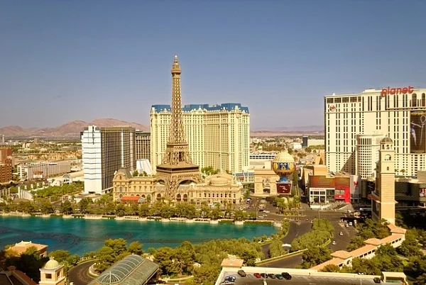 Las Vegas Strip skyline with the Eiffel Tower replica and a lake in front